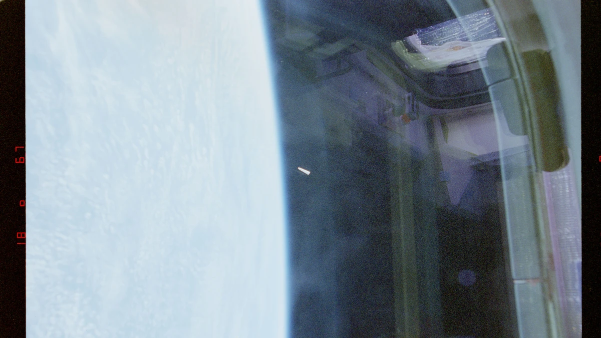 First NASA STS-80 photograph: an unidentified bright elongated object right of the Earth's limb, photographed from Space Shuttle Columbia in 1996