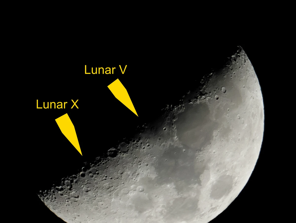 Photograph of a waxing gibbous Moon with the Lunar X and Lunar V labelled along the terminator, the X below and south of the V